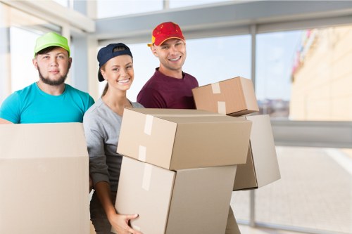 Flat-packed moving boxes and separated recyclables prepared for collection