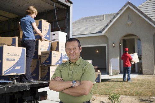 Loading household furniture into a removals van